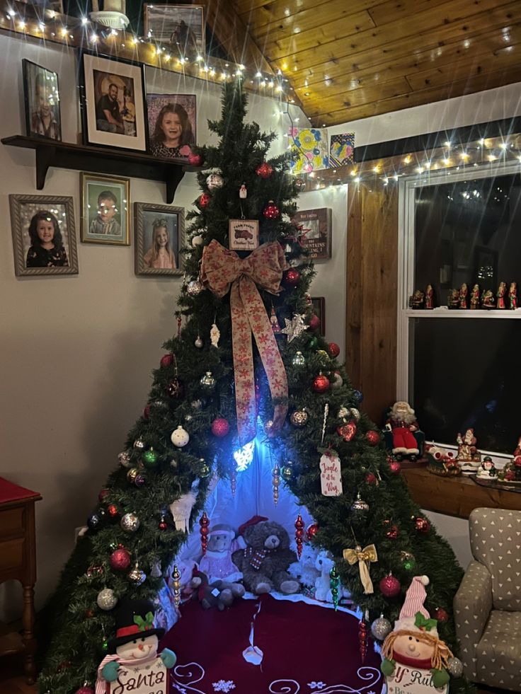 a decorated christmas tree in the corner of a room