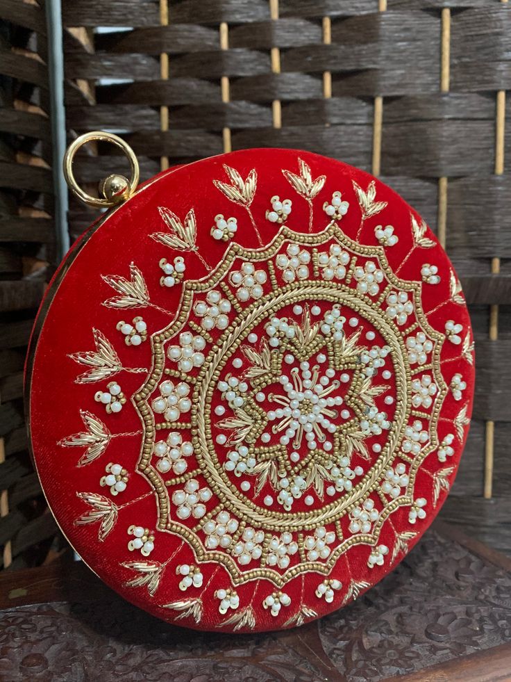 Fashion handbag / clutch . High quality hardware . Crystal work. Velvet body and hand embroidery. Red Rectangular Clutch With Handwork, Rectangular Red Clutch With Handwork, Gold Embroidered Clutch As Gift, Designer Red Embroidered Bag, Traditional Embellished Pouch Clutch, Festive Handheld Handmade Clutch, Luxury Embroidered Clutch Potli Bag, Luxury Embroidered Potli Clutch Bag, Luxury Embroidered Clutch Shoulder Bag