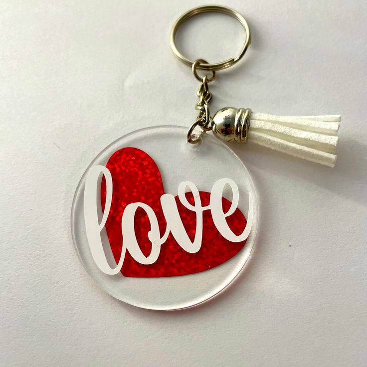 a keychain with the word love painted on it