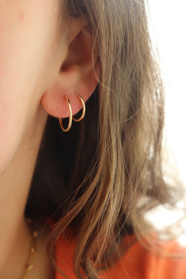 These sweet and delicate little hoops are the newest addition to our earring collection. Simple + effortless, our Goldie Hoops are a favorite for everyday style. MEASUREMENTS Available in 14k Gold Fill or Sterling Silver in 10mm, 14mm, or 16mm diameter14k Rose Gold Fill available in 16mm diameterChoose between a single earring or a pair. Dainty Small Hoop Huggie Earrings For Everyday Use, Dainty Everyday Small Hoop Huggie Earrings, Classic Small Hoop Cartilage Earrings For Everyday, Simple 14k Gold Huggie Earrings For Everyday, Simple Everyday 14k Gold Huggie Earrings, Everyday Simple 14k Gold Huggie Earrings, Everyday 14k Gold Filled Huggie Earrings, Everyday 14k Gold Filled Single Huggie Earring, Tiny Hoop Huggie Earrings For Everyday