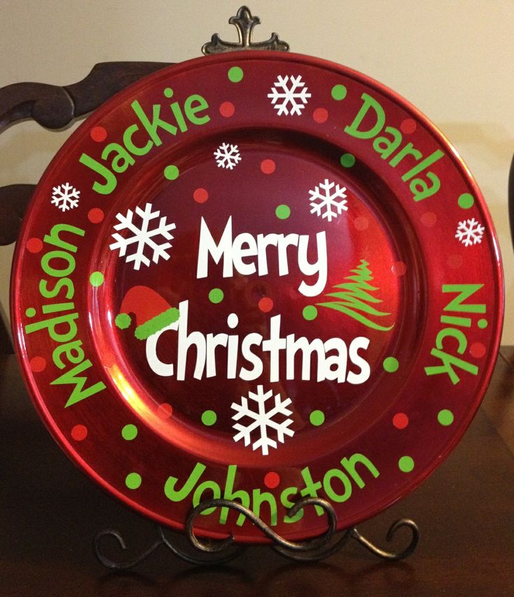 a merry christmas plate sitting on top of a wooden table