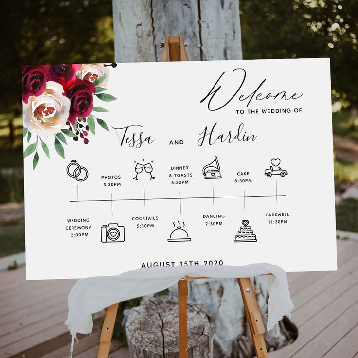 an easel with a sign that says welcome to the bride and groom