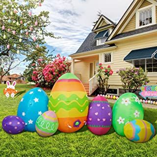 an easter egg display in front of a house