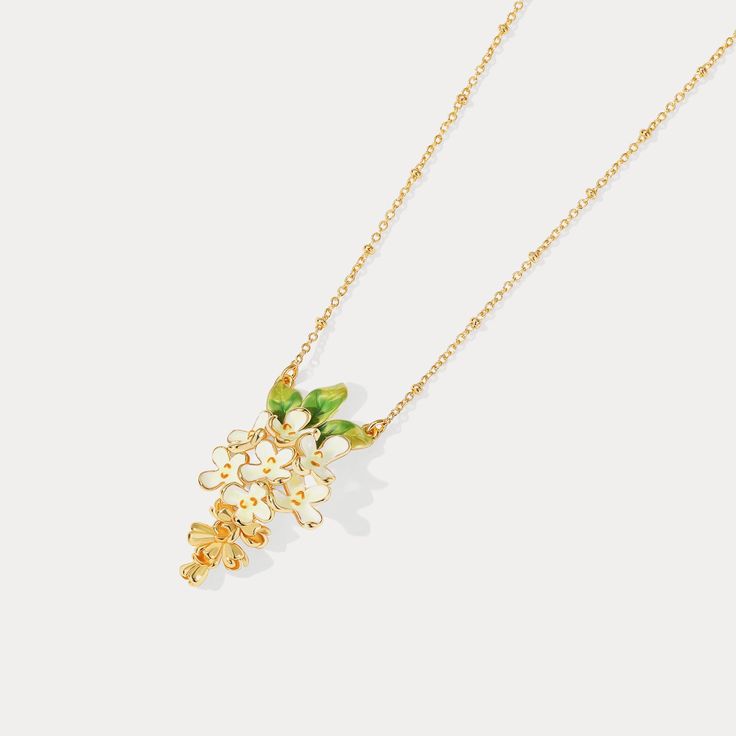 This Osmanthus Fragrans Pendant Necklace is an luxuriously exquisite piece. Handcrafted with beautiful enamel, it is an elegant accessory that will instantly upgrade any formal look. A timeless treasure, it is sure to become a cherished heirloom. DETAILS Plating: 18K Gold Materials: 18K Gold on Brass, Enamel Measurements: Length: 16.53"(42cm) + Extender: 1.97"(5.0cm) Weight:  7.6g Hypoallergenic design Yellow Gold Enamel Flower Jewelry, Yellow Gold Enamel Flower Pendant Jewelry, Elegant Enamel Flower Pendant Jewelry, Elegant Enamel Wedding Necklaces, Yellow Gold Enamel Jewelry With Flower Charm, Enamel Flower Pendant Necklace With Charm, Enamel Flower Pendant Necklace With Flower Charm, Enamel Necklaces With Flower Charm And Pendant, Elegant Enamel Jewelry With Delicate Chain