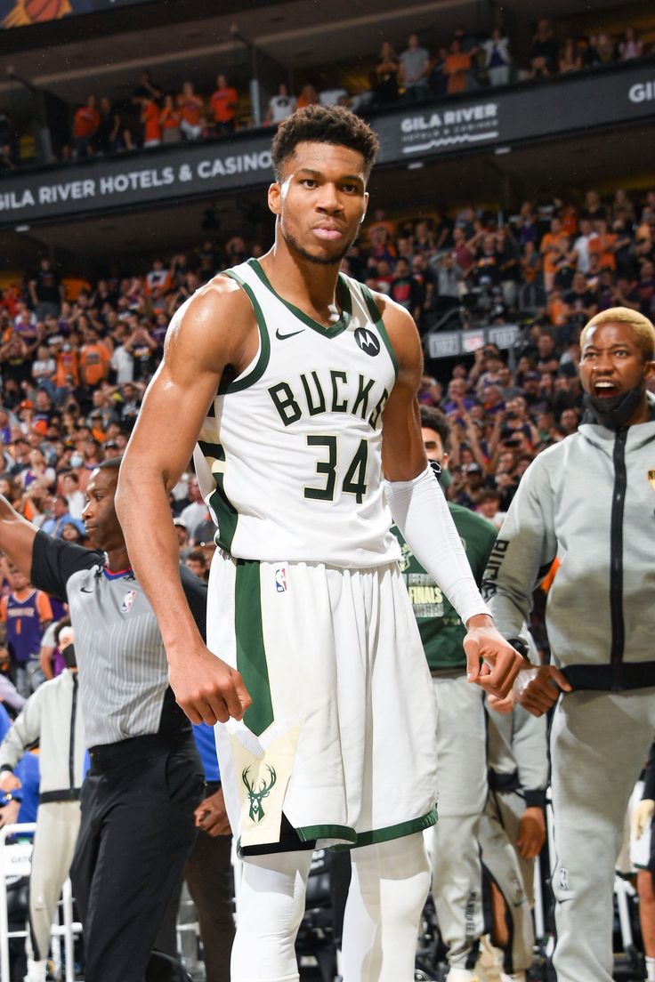 a basketball player is standing on the court