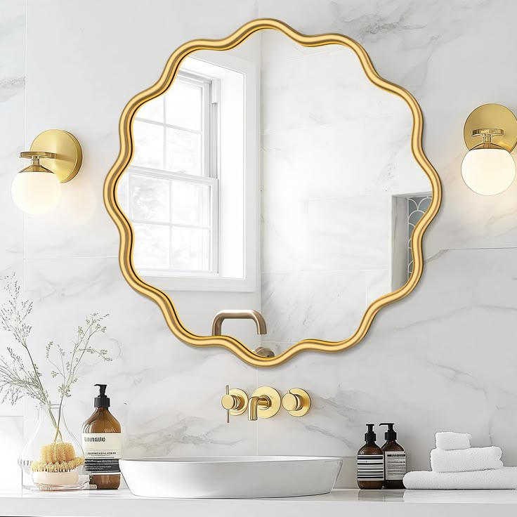 a bathroom with a sink, mirror and soap dispenser on the counter