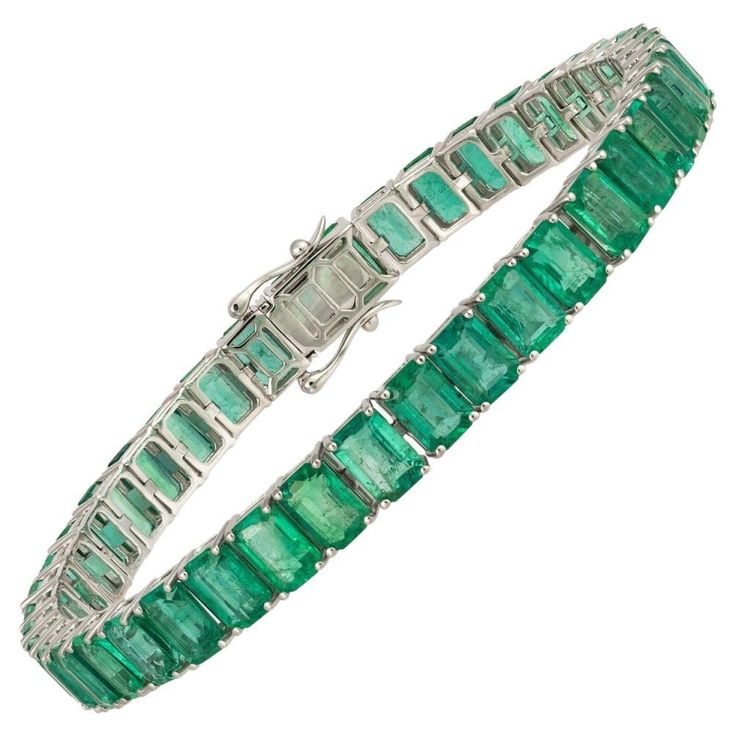 The Following Item we are offering is this Rare Important Radiant 18KT Gold Gorgeous Glittering and Sparkling Magnificent Fancy Emerald Cut Emerald Tennis Bracelet. Bracelet Contains approx 24CTS of Beautiful Fancy Green Emerald Cut Emeralds set in 18KT Gold!!! This Gorgeous Bracelet is a Rare Sample New with Tags Original Price $23,500.00 and is from a Private Manufacturer that sells to Important Five Star Hotel and Fine Jewelry Stores. A Rare Breathtaking Masterpiece!!! Emerald Tennis Bracelet, Red Ruby Bracelet, Emerald Eternity Band, Chanel Set, Diamond Pendants Designs, Ruby Bracelet, Emerald Bracelet, Gold Chanel, Tennis Necklace