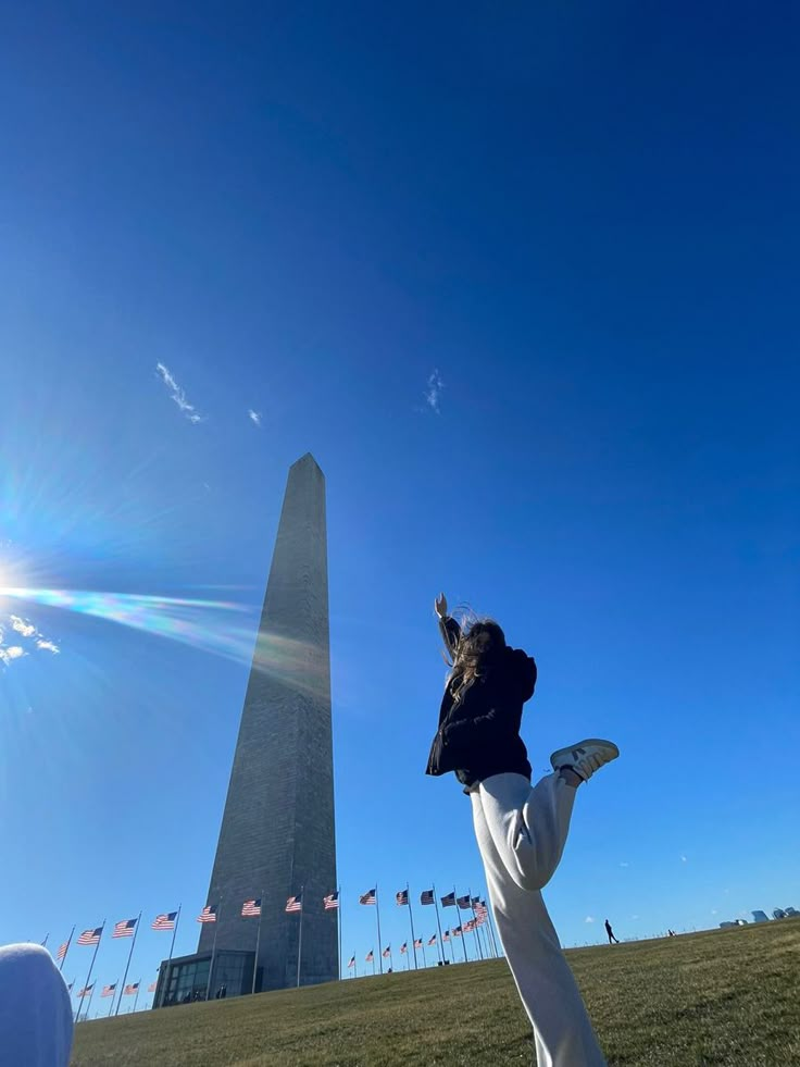 a person standing in front of the washington monument