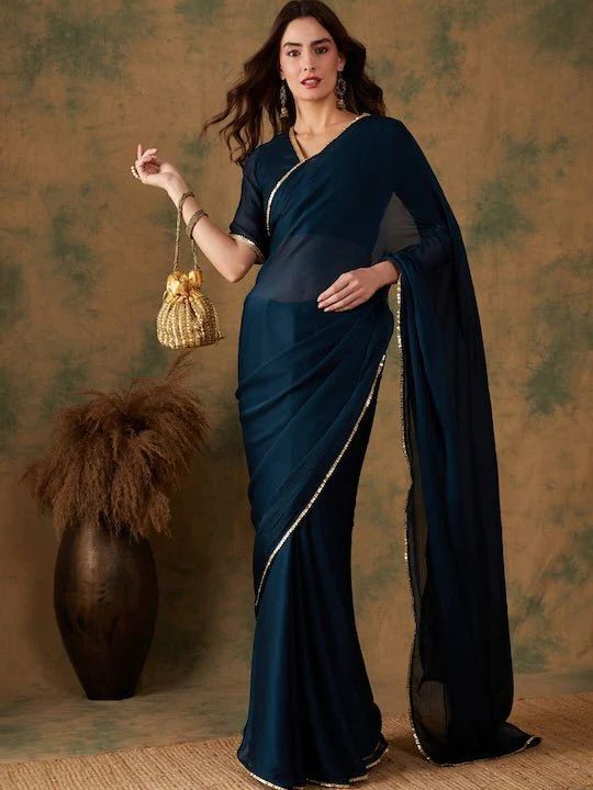 Teal sareeSolid saree with sequined lace borderHas woven-designed detailThe saree comes with an unstitched blouse pieceThe blouse worn by the model could be for modelling purpose only, please check the image of the actual blouse piece Sarees For College Fest, College Farewell Saree Ideas, Farewell Sarees Colleges, Isha Borah, Indian Fits, Eastern Wear, Desi Fits, Wedding Sarees Online, Formal Saree