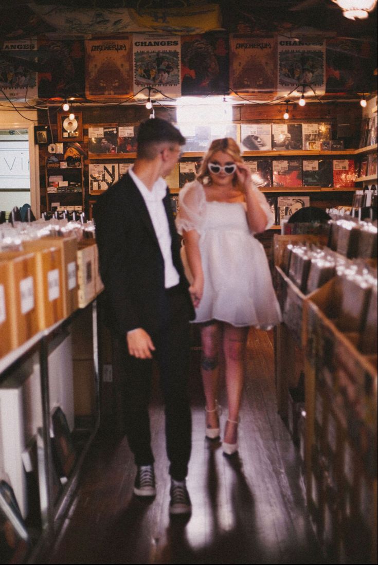 a man and woman are standing in a store