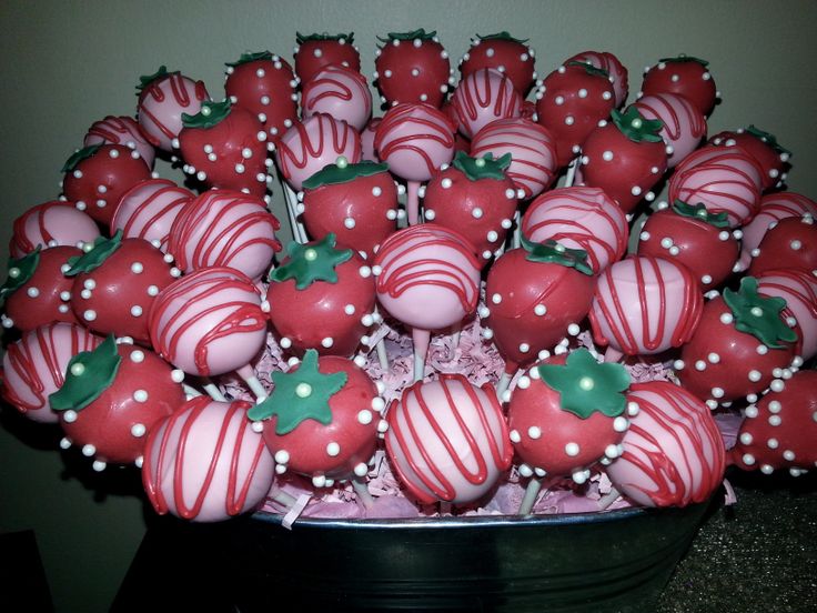 chocolate covered strawberries are arranged in a bowl