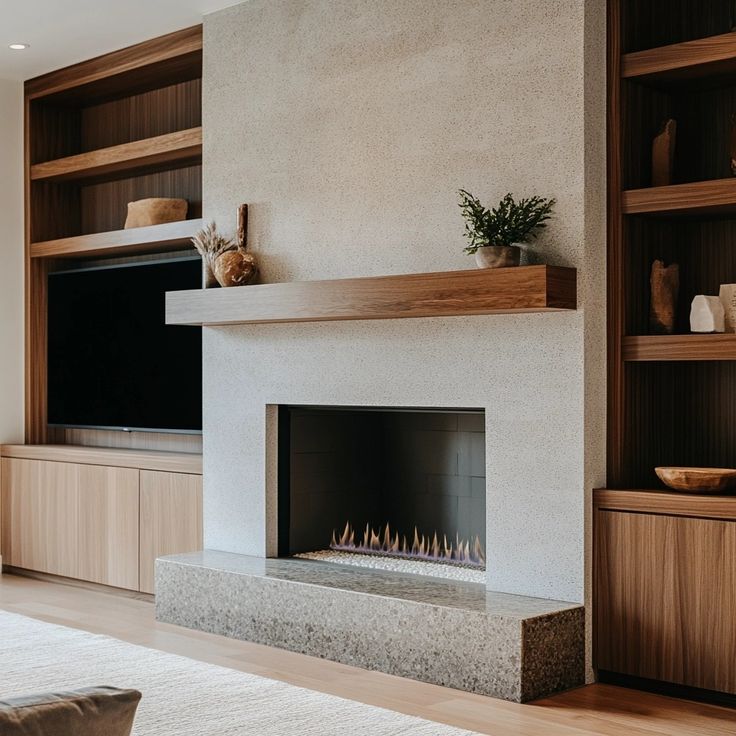 a living room with a fireplace and entertainment center