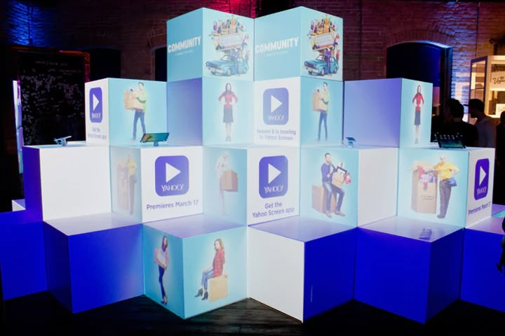 an interactive display with people standing around it