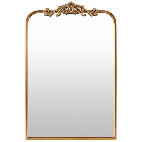 an ornate gold framed mirror on a white background