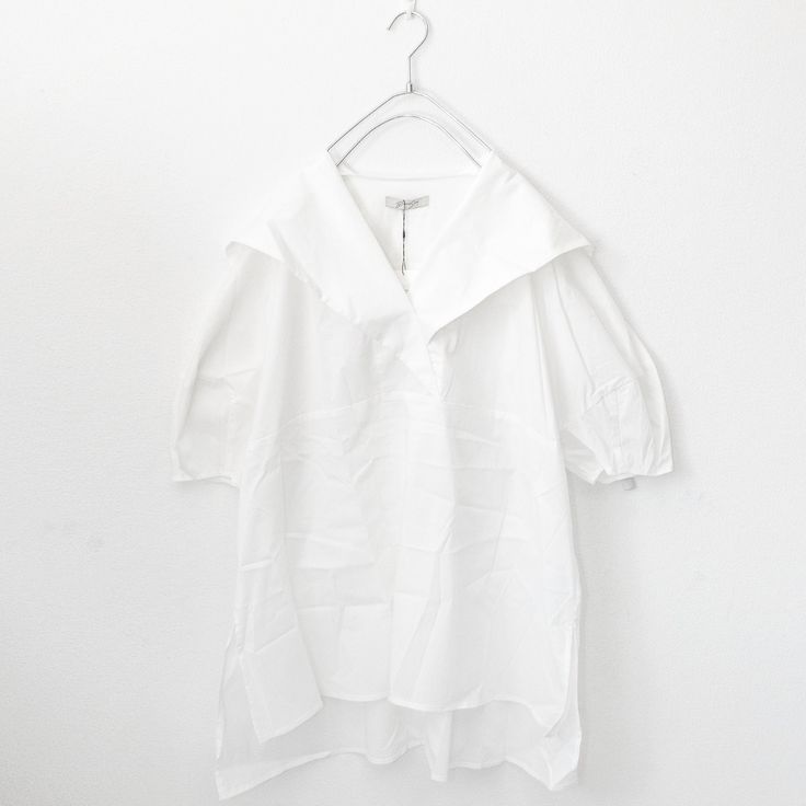 Big collar back flap short sleeve shirt. Ship from Japan Imported Limited stock (One Size)length 75cm/81cmwidth 65cm 60% cotton 34% nylon 6% polyurethane Summer Top With Collar And Placket, Summer T-shirt With Placket And Short Sleeves, Summer Half Sleeve Shirt With Placket, Summer Half-sleeve Shirt With Placket, Summer Short Sleeve Shirt With Collar And Placket, Relaxed Fit Short Sleeve T-shirt For Daywear, White Short Sleeve Tops With Rolled Sleeves, Summer Short Sleeve Shirt For Daywear, Fitted Short Sleeve Shirt