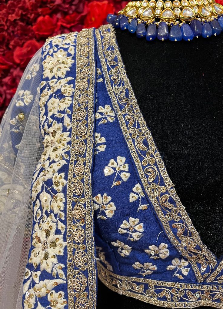 Subtle hues of whimsy blend with floral embroideries in this Royal Blue lehenga. The mehreen lehenga, embroidered with beautiful floral motifs and golden embroidery work, looks every bit of the royal self! Color - Fabric & Work Style -- Silk lehenga: Rich embroidery, floral embroidery work.- Silk embroidered blouse.- Net dupatta. Details -- Assured quality.- Wash care instruction: Dry clean only.- Slight variation in color is possible due to digital photography. Royal Blue Lehenga, Indian Bridal Couture, Golden Embroidery, Fabric Work, Bridal Packages, Celebrity Closet, Blue Lehenga, Embroidery Floral, Silk Lehenga