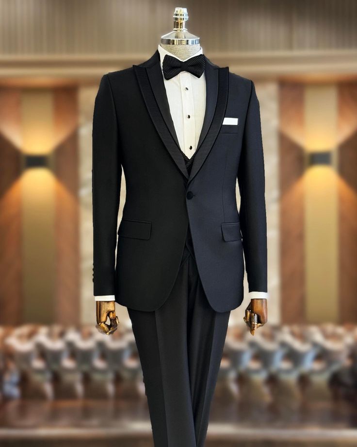 This men's black tuxedo suit is a must-have for any modern gentleman's formal wear collection. When you want to make a stylish entrance at your next event, this stunning slim-fit black blazer will help you do just that. Crafted from high-quality materials, this single-breasted tuxedo jacket is fully lined and features two exterior pockets. Perfect for formal occasions, this tuxedo ensures you look sharp and confident, offering great versatility and a flattering fit for your body. Remarks : Dry Clean Only Silk Satin Peak collar Material: 65% Polyester, 32% Viscose, 3% Lycra Cutting: Single Button, Double Slits Package included : Jacket, Vest & Pants Mens Suit For Wedding, Slim Fit Groom Suit, Tuxedo Prom, Black Tuxedo Suit, Suit 3 Piece, Suit For Wedding, Mens Wedding Suits, Slim Fit Tuxedo, Lapel Jacket