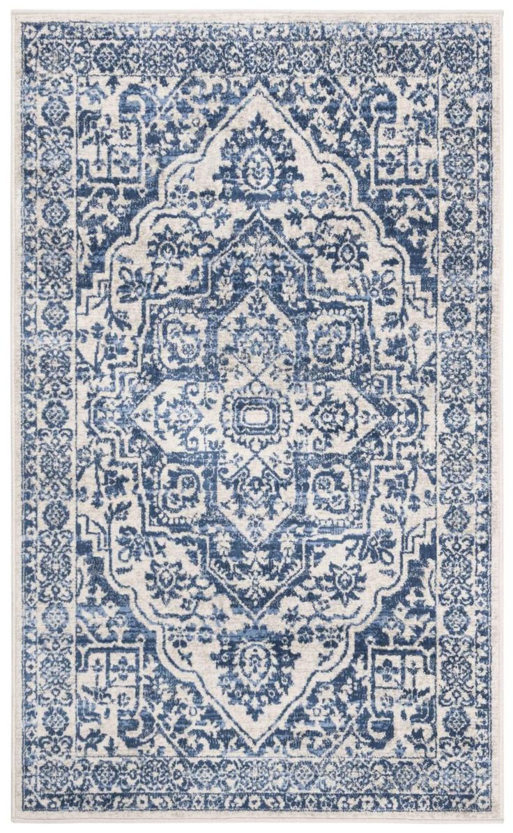 a blue and white rug with an intricate design