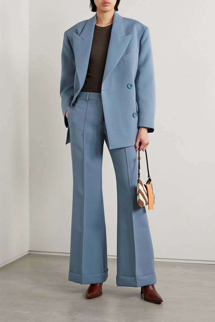 The dramatic peak lapels and double-breasted construction of Acne Studios 'Jokil' blazer are what make it look so sharp and polished. Made from twill for a relaxed fit, it has lightly padded shoulders for structure and a full lining to ensure smooth layering. Wear it with the coordinating pants in the same dusty-blue shade. Luxury Light Blue Notch Lapel Outerwear, Chic Pantsuit With Pressed Crease And Lapel Collar, Designer Tailored Double-breasted Blazer, Chic Suits With Pressed Crease And Lapel Collar, Evening Suit With Double Button Closure And Notch Lapel, Chic Office Blazer Dress With Pressed Crease, Chic Double-breasted Formal Pantsuit, Modern Structured Pantsuit For Formal Occasions, Chic Formal Suits With Welt Pockets