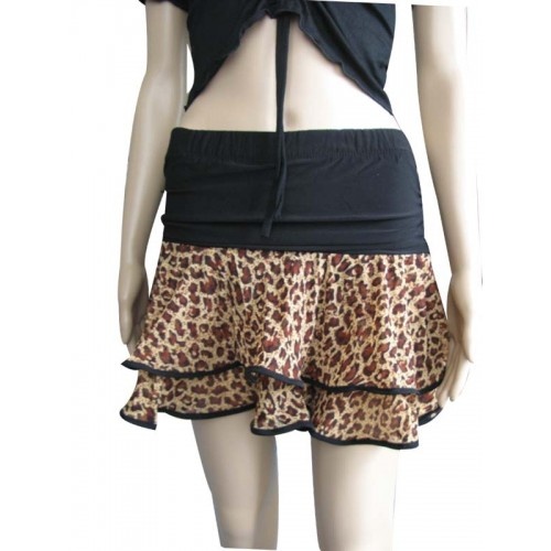 a female mannequin wearing a black top and leopard print ruffled skirt with an open back