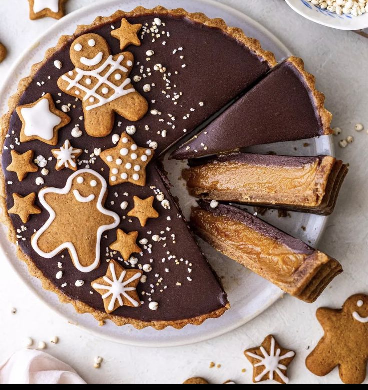 a chocolate cheesecake with gingerbread cookies on top