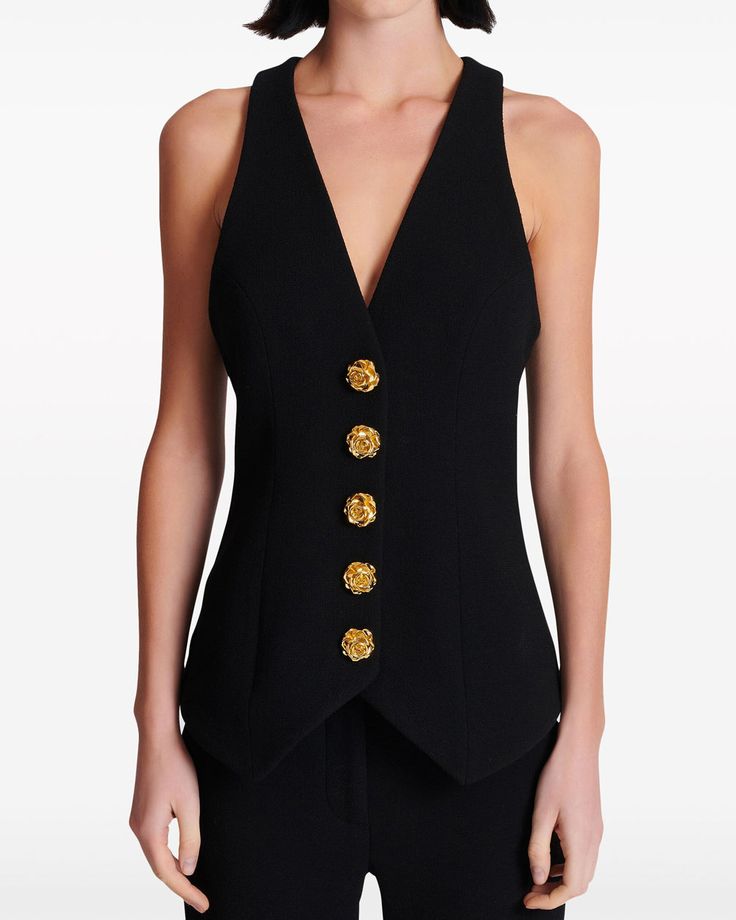 Balmain Noir Sleeveless Button Vest Deep v neck Sleeveless Front button closure Gold tone statement buttons Tailored fit 100% wool Luxury Sleeveless Dress With Button Closure, Luxury Sleeveless Top With Embellishments, Luxury Black Blazer With Vest, Luxury Sleeveless Winter Blazer, Luxury Elegant Top With Back Button Closure, Luxury Black Top With Hidden Button Closure, Luxury Sleeveless Embellished Top, Luxury Sleeveless Blazer, Luxury Sleeveless Dress With Buttons