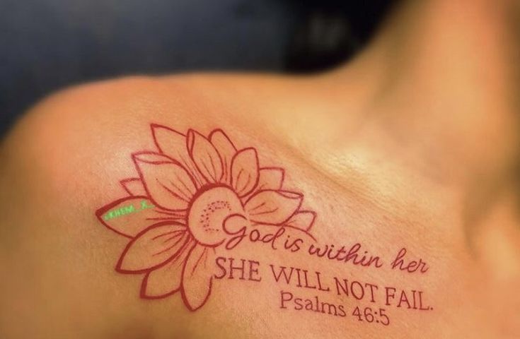 a woman with a tattoo on her shoulder that says god is within her she will not fail