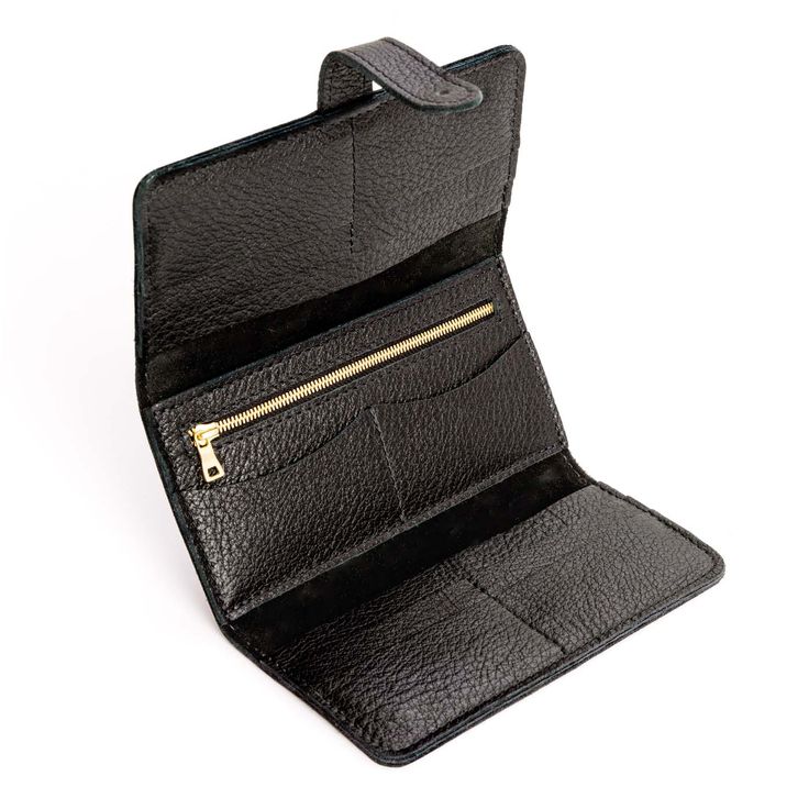 Pebbled--black | Leather wallet with Sam Browne closure open Compact Leather Trifold Wallet For Everyday, Everyday Trifold Coin Purse With Card Slots, Everyday Trifold Coin Purse With Interior Card Slots, Everyday Trifold Clutch With Card Slots, Black Bifold Clutch With Card Slots, Travel Black Coin Purse With Coin Pocket, Travel Coin Purse With Coin Pocket In Black, Bifold Coin Purse With Interior Card Slots For Travel, Versatile Trifold Wallet With Coin Pocket For Daily Use