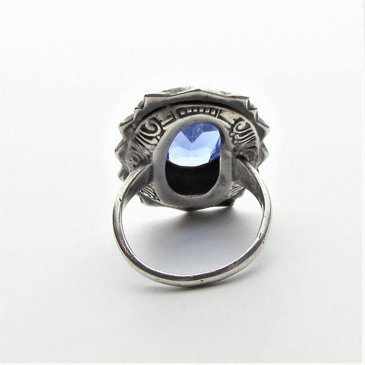 "Victorian marcasite, art glass cabochon and sterling silver statement ring, perhaps originally a mourning ring! This ring appears to be from the latter part of the 1800's and per the gemologist was typically worn with those high collared long black dresses of the period that one sees in old photos and many times as a mourning ring (also known as a memory ring). It is a large piece with the crown measuring approximately 25 mm by 19 mm. and rising a comfortable 7.5 mm from the finger to the very Vintage Hallmarked Rings For Memorial, Victorian Cabochon Rings As Gifts, Victorian Cabochon Rings For Gift, Victorian Cabochon Rings As A Gift, Victorian Hallmarked Silver Signet Ring, Antique Oval Collectible Rings, Vintage Gemstone Jewelry For Memorial, Vintage Oval Cabochon Sapphire Ring For Formal Occasions, Victorian Memorial Jewelry Ring