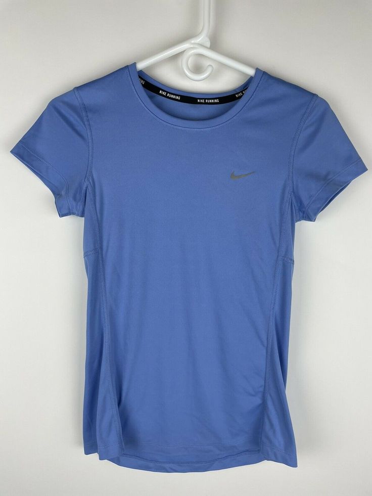 Nike Women's DRI-FIT Miler Running Top T Shirt - Light Blue - Size Extra Small This Nike Dri-Fit Shirt is in great condition. It has no rips or stains. It is a size extra small. Short sleeve with a reflective design on the upper back. Blue in color.  Every item sold on this store is sold by: Take It For Granted, LLC (established in 2019) Please be prompt with your payment after purchase. I aim to ship your product within 24 hours of purchase but up to 72 hours of purchase. All shipping details w Running T Shirt, Runing Shoes, Dri Fit Shirt, Nike Tshirt, Top T Shirt, Running Shirts, Athletic Shirts, Running Tops, Slim Fit Shorts