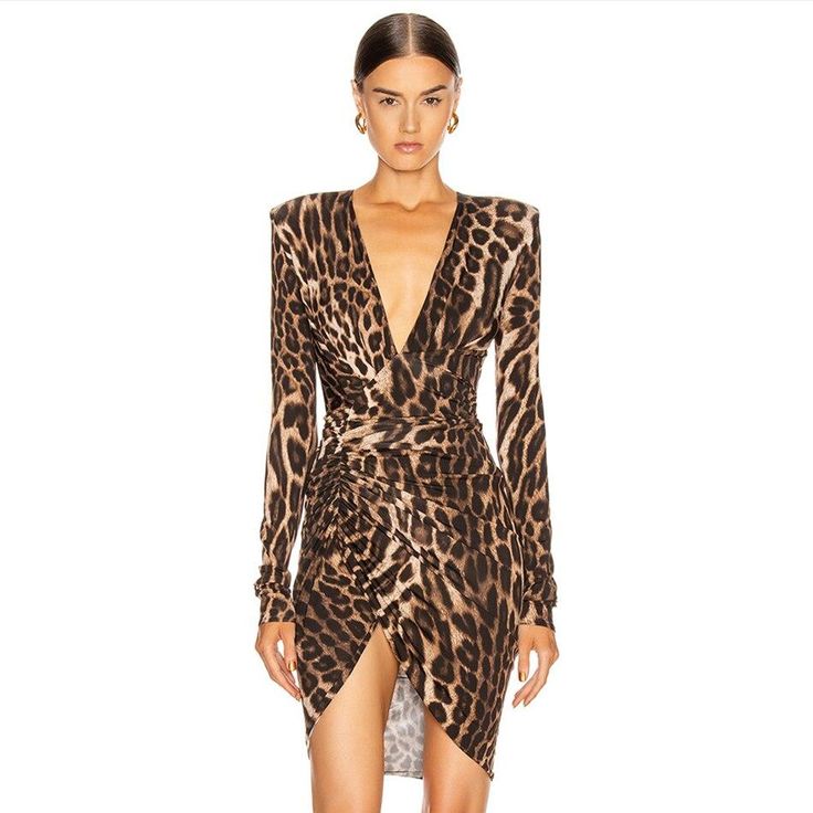 Leopard printed dress. A plunging neckline and high back. Long sleeves feature shoulder paddings. The design of the dress highlights the waist. Asymmetrical skirt with regular pleats. Dappled-print inner lining.[custom tab]FABRIC #1: 95% VISCOSE 5% ELASTANE | FABRIC #2: 100% POLYAMIDE | LINING #1: 78% POLYAMIDE 22% ELASTANE[/custom tab] Jungle Dress, Queen Of The Jungle, Dress Queen, Haute Couture Designers, Plunge Bodysuit, Alexandre Vauthier, Queen Dress, Couture Designers, Body Dress