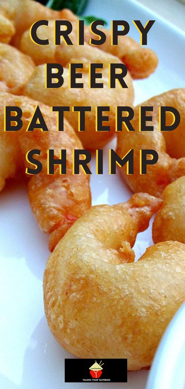 crispy beer battered shrimp on a white plate with text overlay that reads crispy beer battered shrimp