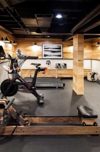 an indoor gym with exercise bikes and treadmills