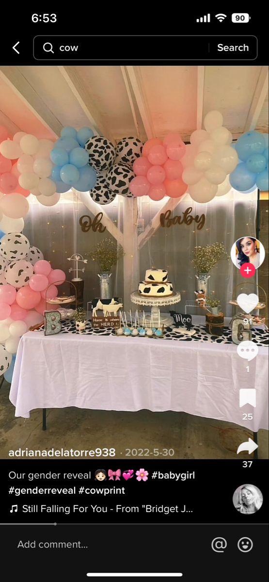 a table with balloons and cake on it