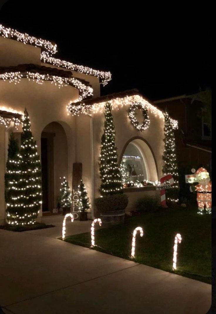 christmas lights decorate the outside of a house