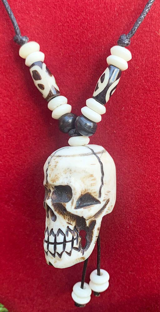 Skull pendant Necklace with adjustable black cord. Handmade in Nepal from Yak bone. The adjustable necklace can be extended to 28 inches or shortened to 14 inches. Unique Adjustable Bone-colored Necklace, Adjustable Skull Necklace For Festivals, Bone Color Bohemian Adjustable Necklace, Unique Adjustable Bone Necklace, Unique Adjustable Bone Colored Necklace, Adjustable Bone-colored Jewelry For Festival, Adjustable Bone Color Jewelry For Festival, Adjustable Bone-colored Jewelry For Festivals, Skull Pendant Necklace