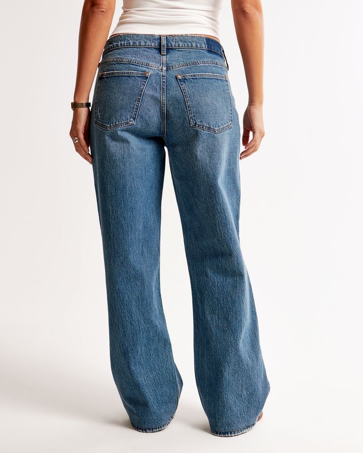 Our Curve Love low rise baggy jeans in a medium wash with a clean hem. This fit features a 8.5” low rise, is slightly relaxed at waist and hips, and eases at the thigh into a baggy, full-length leg shape. We recommend buying your true size for a baggier fit. Size down for a closer fit. The viral fit that eliminates waist gap: Curve Love features additional room through the hip and thigh for curve-hugging comfort. This jean is made from our vintage stretch fabric which features both an authentic Mid-rise Washed Flare Jeans With Relaxed Fit, Mid-rise Washed Relaxed Fit Flare Jeans, Medium Wash High Rise Relaxed Fit Flare Jeans, Everyday Medium Wash Full-length Flare Jeans, Everyday Medium Wash Full Length Flare Jeans, Medium Wash Relaxed Fit Flare Jeans In Rigid Denim, Mid-rise Medium Wash Relaxed Fit Flare Jeans, Medium Wash Relaxed Fit Flare Jeans, Relaxed Fit Medium Wash Flare Jeans