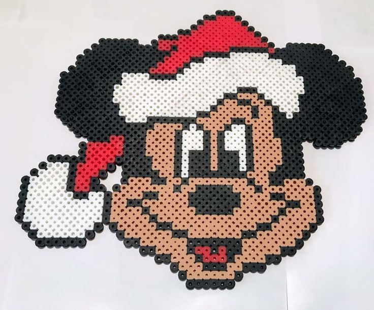 a mickey mouse christmas ornament made out of perler beads