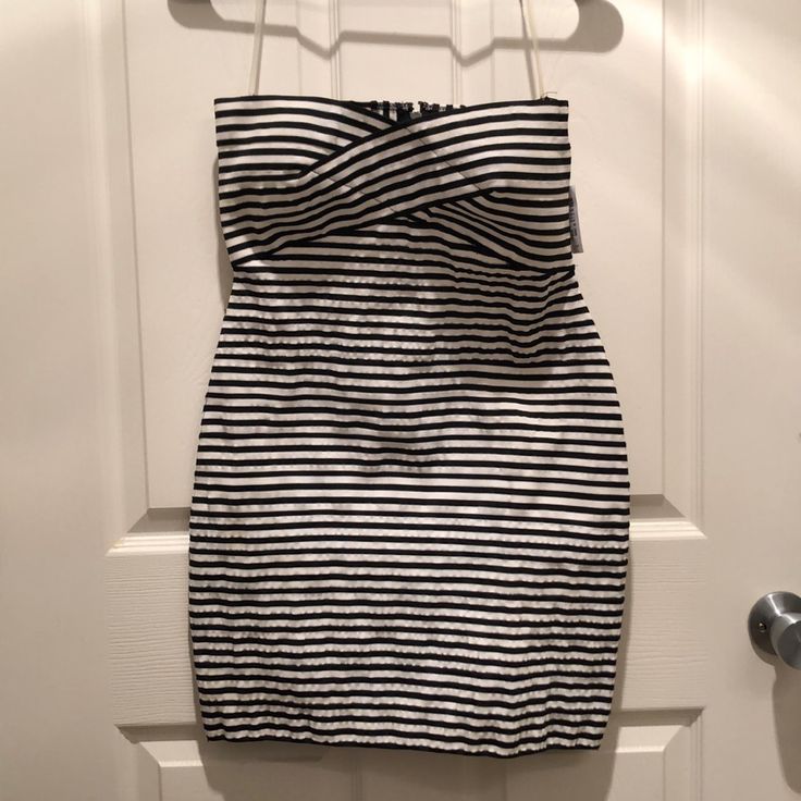 Black & White Striped Dress. Cut Out Back. Brand New, Never Been Worn. Fitted Strapless Striped Dress, Striped Summer Evening Dresses, Striped Evening Dresses For Summer, Elegant Black And White Mini Dress For Summer, Striped Lined Party Dress, Chic Fitted Black And White Mini Dress, Party Striped Lined Dresses, Chic Black And White Bodycon Dress, Black And White Summer Evening Dress