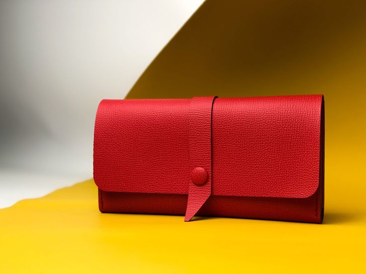 "This red personalized wallet for women that can be used as a wallet or a mini clutch for daily walks. A leather wallet  accommodate not only banknotes, it will also take care of your credit cards, coins . This custom wallet make a beautiful personalized gift for her, sister birthday gift, wife birthday gift. All 13 used Materials ▪️ Natural Italy leather, colors Parrot ▪️ Flap with buttons with is leather ▪️ 3 interior pocket for cash, Phone compartment or checkbook ▪️ 1  pocket with button for coins , receipts,  and more           ▪️ 12 card slots fits up to 24+ cards       ▪️ Width: 7.87 \" ( 20 cm) ▪️ Height:  4.52 \"  (11.5 cm)    ▪️  100% handmade by traditional sewing method. ▪️  Each stitch is handcrafted for a durable and beautiful finish. ▪️ The edges are waxed and polished for a Modern Envelope Wallet As A Gift, Modern Clutch With Interior Card Slots For Gift, Modern Clutch With Interior Card Slots As Gift, Modern Envelope Wallet For Gifts, Elegant Trifold Bag As A Gift, Modern Bifold Bag For Gift, Classic Clutch With Interior Card Slots, Classic Clutch Wallets As Gifts, Leather Clutch With Magnetic Closure For Gift