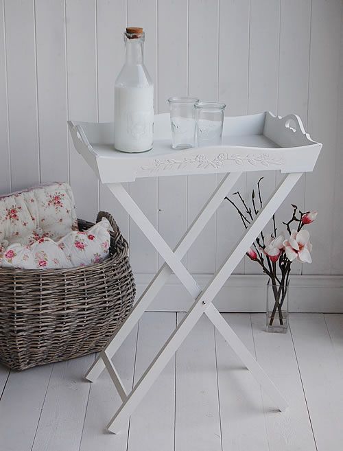 a wicker basket and bottle on a white table