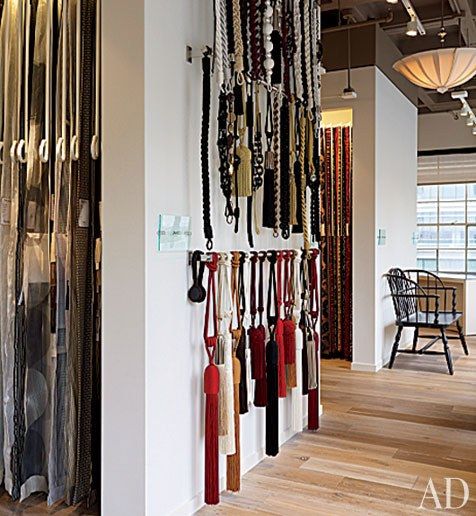 a room filled with lots of necklaces hanging on the wall