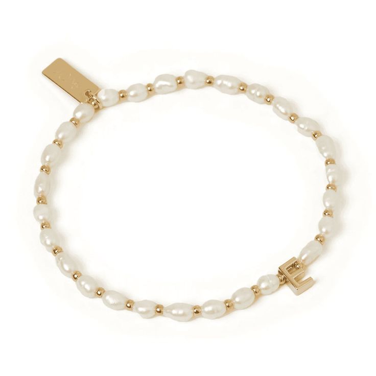 Personalize your elegance with the Initial Pearl Bracelet, crafted from lustrous freshwater pearls and adorned with an initial of your choice. A perfect blend of timeless beauty and personal flair! 14k Gold Plating Premium Finish Freshwater Pearls Lead & Nickel Free Elastic stretch to fit perfectly Tarnish Resistant Jewelry Lookbook, Charm Rings, Bead Charm Bracelet, Chain Choker, Bracelet Stack, Pearl Bracelet, Gold Plating, Timeless Beauty, Bead Charms