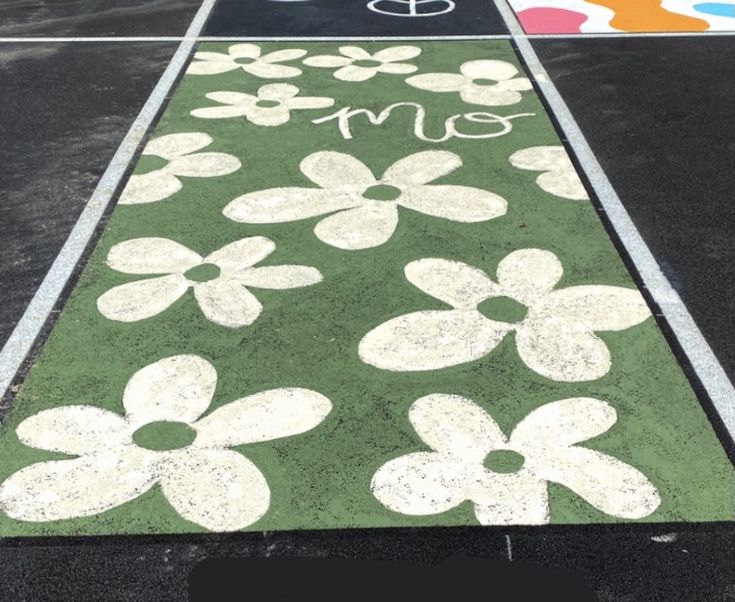 a painted walkway with flowers on it