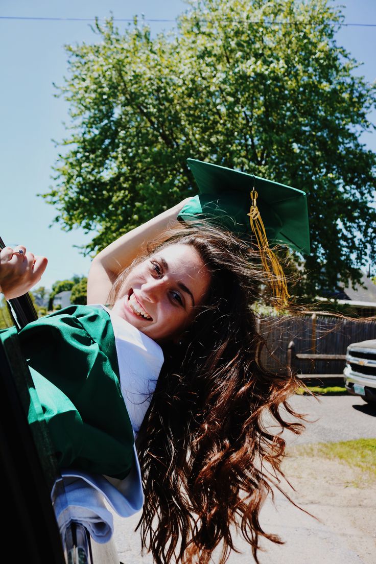 a young woman in her graduation cap and gown