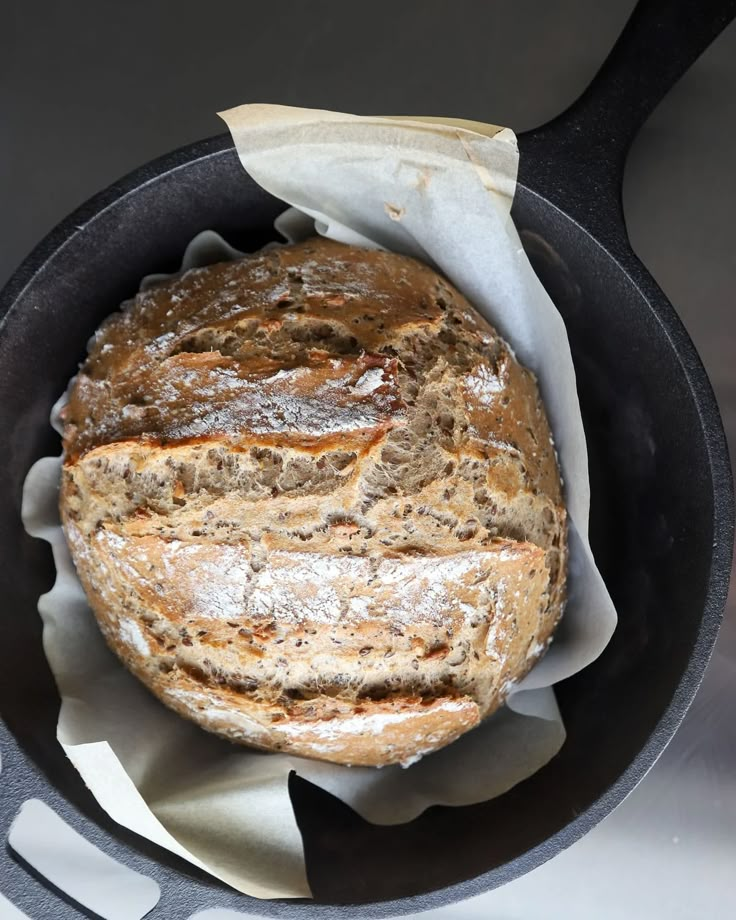 a loaf of bread in a cast iron skillet