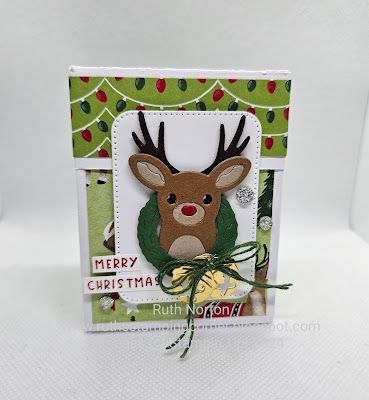 a close up of a card with a deer on it's face and the words merry christmas