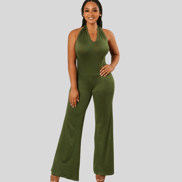 Introducing Elina, the ultimate combination of style and comfort. This Halter Neck Loose leg Jumpsuit is perfect for those who want to make a statement while staying effortlessly chic. Elevate your wardrobe with Elina today! Chic Stretch Bodysuit Overall, Chic Stretch Overall Bodysuit, Solid Stretch Bodysuit For Date Night, Chic V-neck Elastane Jumpsuits And Rompers, Versatile Fitted Jumpsuits For Night Out, Versatile Fitted Jumpsuits And Rompers For Night Out, Chic Solid Color One-piece Bodysuit, Fitted One-piece Jumpsuits For Workwear, Solid Sleeveless Bodysuit For Date Night