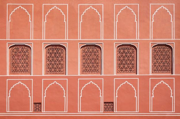 an intricately designed wall with arched windows