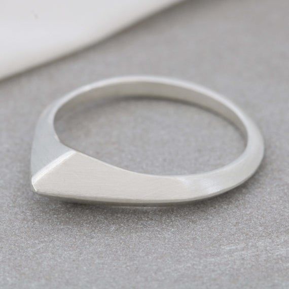 A beautiful tactile ring for her, this sterling silver curved ring for women is a carved asymmetrical ring that is easy to wear every dayThis art deco inspired organic signet ring was originally hand carved in wax before being cast into metal.The tactile curves of this geometric ring make it really comfortable to wear.Made to your chosen ring size using solid sterling silver, perfect on any finger, or as a thumb ring, whether it is worn alone as minimalist jewellery or mixed and matached with da Asymmetrical Ring, Jewelry Making Workshop, Curved Ring, Cast Rings, Curve Ring, Diamond Signet Ring, Minimalist Jewellery, Stacker Rings, Carved Ring